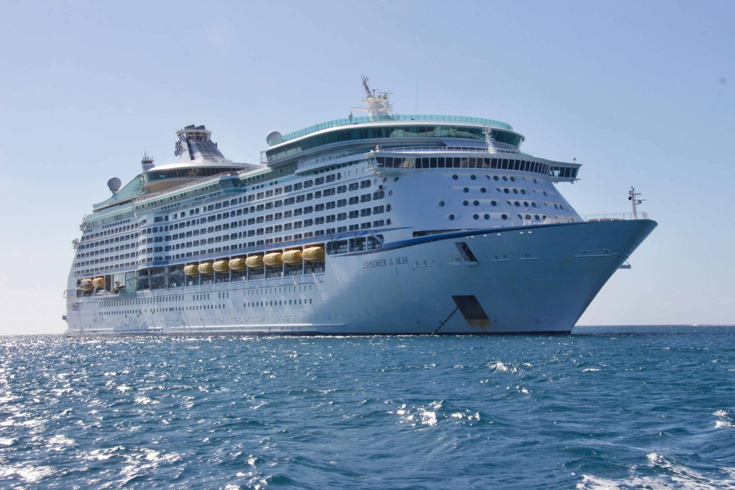 Luxury cruise ship sailing in the ocean during sunset